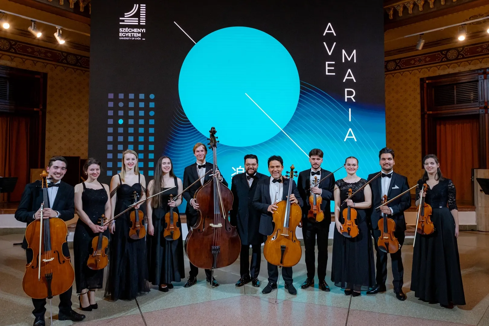 The Jávorkai brothers and members of the University String Orchestra at the Ave Maria documentary premiere in Győr. (Photo: András Adorján)
